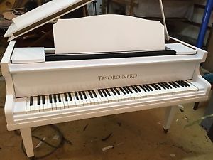 White Baby Grand Piano