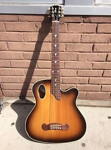 Gibson traveling songwriter *RARE model* sunburst.  Formally owned by Los Lobos!