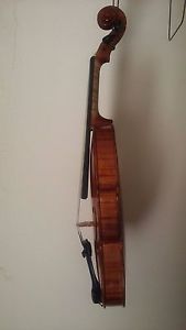 1/2 size , cute handmade violin with a corresponding bow - stamped "W German"