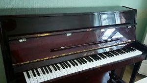 steinbach upright piano. High gloss mahogany finish.