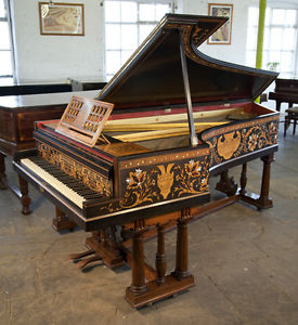 Stunning, 1891, Broadwood grand piano with an intricately inlaid case.