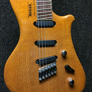 Novax fanned fret expression guitar with lacewood top flame maple back