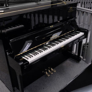 Used Yamaha U1 upright piano in polished black C1975