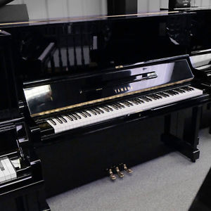 An incredible refurbished Yamaha U3 upright piano in polished black