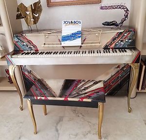 Piano with brass legs by Winter & Company
