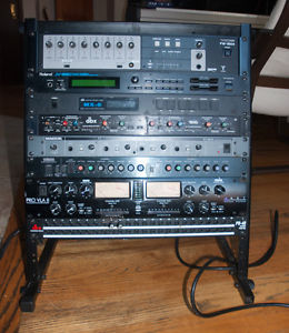 Audio rack with tascam 1804, dbx 166, jv-880, art pro vla 2, yamaha gc2020 +more