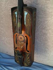 Yes! 'Santa Fe' carved, antique style, resonator cello!