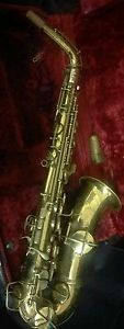 C.G.Conn Alto SaxophoneGold plated  circa 1920s. Mother of pearl inlay.