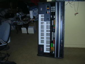 VINTAGE WURLITZER OMNI 6500 ANALOG DUAL KEYBOARD SYNTHESIZER, W/STAND & PEDALS.