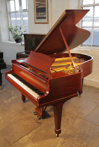 A 1926, Steinway Model M grand piano with a mahogany case. 88 note keyboard.