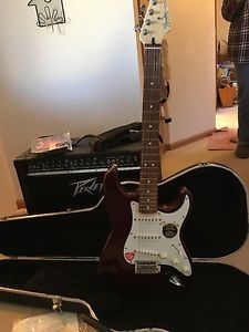 fender stratocaster guitar,  and peavey bandit 112 transtube amp