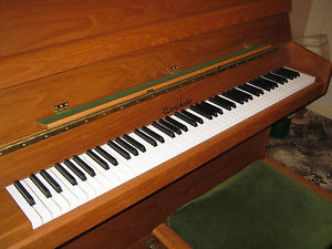 Woodchester Elmore upright piano 1997 in satin teak with piano stool