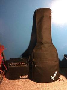 black and white fender guitar with crate amplifier