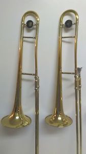 TWO NICE USED GOLD 605 AND 606 KING TROMBONES