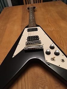Black Gibson Flying V guitar with hardcase