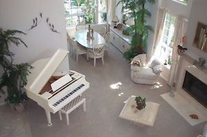 white baby grand piano by kohler and campbell