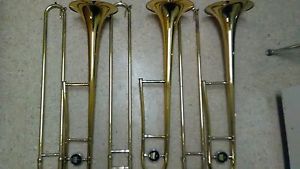 3 USED GOLD 606 606 AND 606 KING TROMBONES