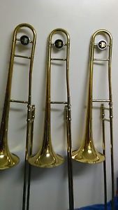 3 USED GOLD 606 606 AND 606 KING TROMBONES