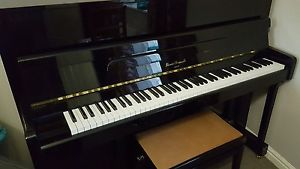 Black Upright Piano and Stool