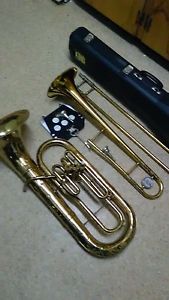A NICE USED OLDS GOLD BARITONE AND USED GOLD KING TROMBONE AND MORE.