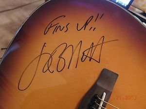 Yamaha Acoustic dreadnought guitar autographed by Jimmy Buffett