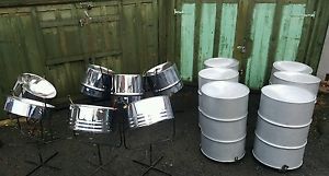 Full set of chrome steel pan drums ( silver bass ). Stands and sticks included.