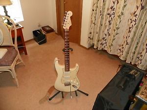 AM Fender Stratocaster. White, w/case and lots of extras.