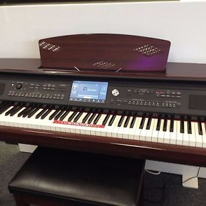 YAMAHA CLAVINOVA CVP609PM IN MAHOGANY POLYESTER. SUPERB CONDITION WITH STOOL