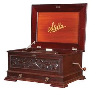 Mahogany cased Stella music box with 9 metal records, panel top, carv... Lot 258