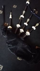 Set of MacLeod Highland Bagpipes. Engraved Nickel with case and practice chanter