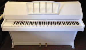 Eavestaff Miniroyal in a White Satin cabinet