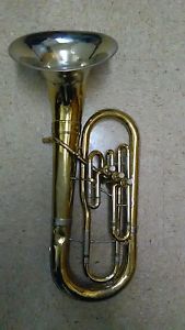 IA USED GOLD OLDS BARITONE WITH SILVER BELL WITH 2 TROMBONE SOLF CASES