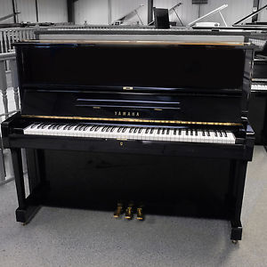 Used Yamaha U1M upright piano in polished black C1983