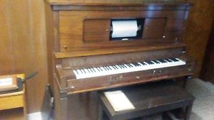 The Aeoulian Co Player piano 543T and music rolls