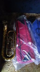 IA USED GOLD OLDS BARITONE WITH SILVER BELL WITH 2 TROMBONE SOLF CASES