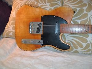 Telecaster style guitar distressed / aged finish.