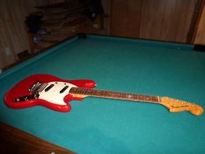 Fender Mustang Guitar ( Vintage) with case and amplifier. Serial number L68683.
