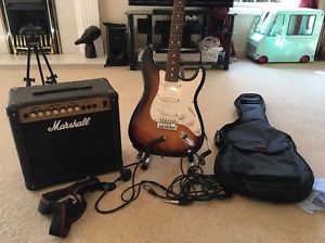 Squier Strat By Fender Electric Guitar & Marshall Amplifier With Case & Stand