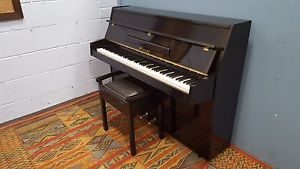 Gloss black "Rogers" 88 note overstrung piano.