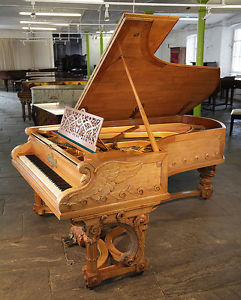 Unique,1895, Bechstein Model C grand piano with an ornately carved, walnut case