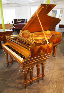 An 1886,  Rococo style, Steinway Model B grand piano with a gold case