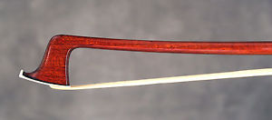 A very fine French certified violin bow by C.Thomassin,1905.