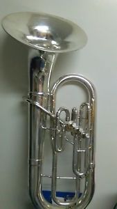 A USED SILVER OLDS BARITONE