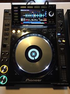 Two Pioneer CDJ 2000 Nexus And Pioneer DJM900-SRT