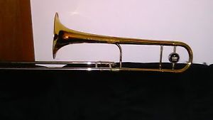 A USED LATE 1970 4B LARGE BORE KING TROMBONE WITH NEW SLIDE SAVERS AND 2 CASES