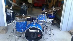 Vintage ludwig 3 piece drum set, pearl snare, hi hats, 3 cymbals, and China.