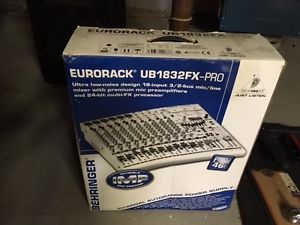 DJ equipment, sound board, speakers and stands.