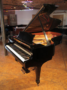 A 2004, Steinway Model B grand piano with a black case