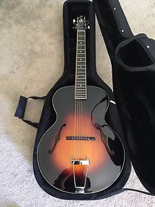 The Loar LH-600 Archtop Acoustic Vintage Sunburst Hand Carved Guitar.