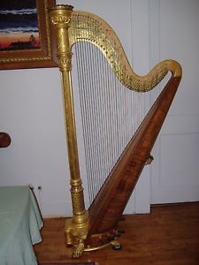 Antique gold Lyon & Healy 1906 semi-grand pedal harp. Slight cosmetic damage.